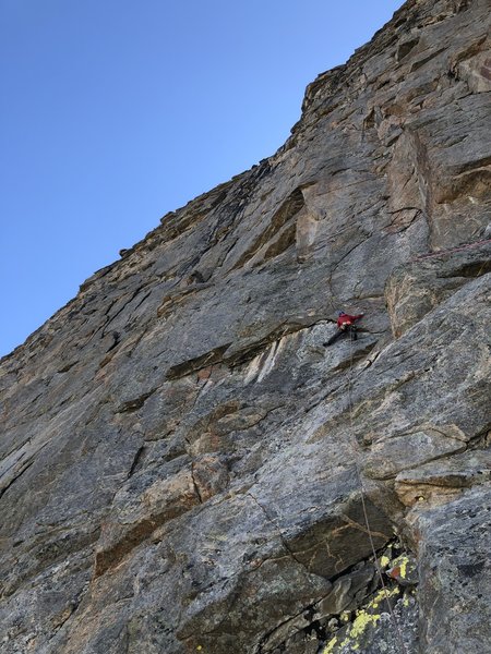 P9 climbing off of Der Major. The optional belay is down and to the right at the base of the large corner.