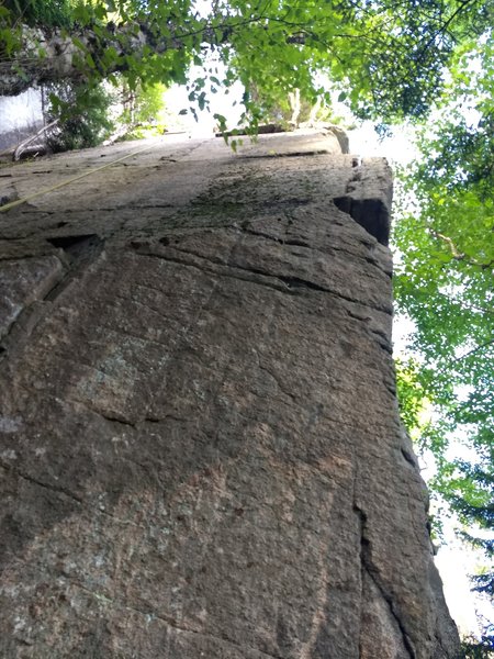 "Balancing Act" climbs the arete that forms the right end of the Double D face. Gain the arete via the first horizontal off Double D right, or start on Black Mamba for more mileage. Devious thin climbing past the third bolt on the arete marks the crux.