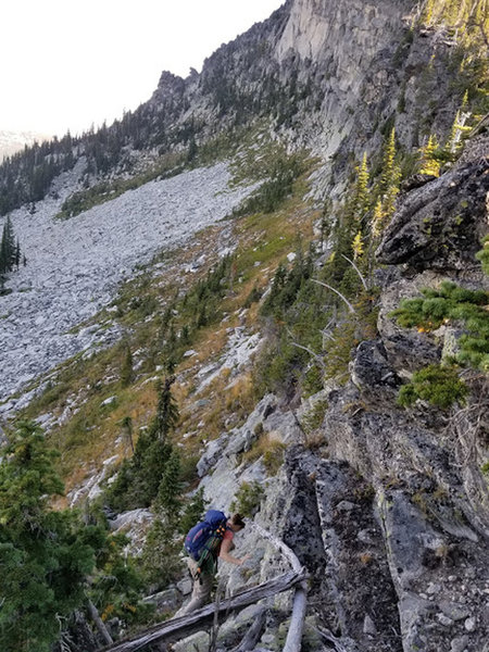 Madi Descending from the ridge to the West face of Silver dollar. This is an easy down climb for roughly 15 feet.