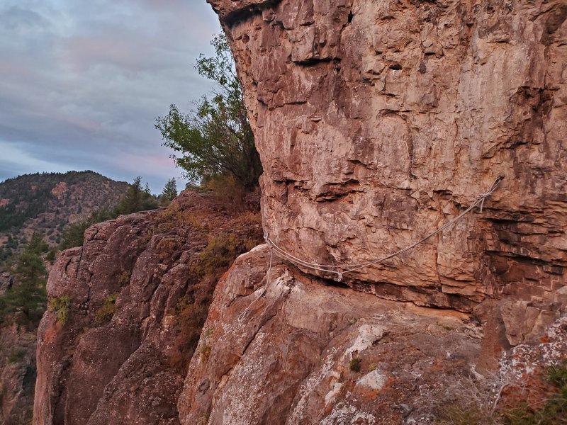 Traverse around the arete. The rope currently is too worn to trust with a massive coreshot