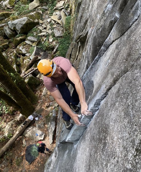 Gabe Webster using his guns to pull past the crux.