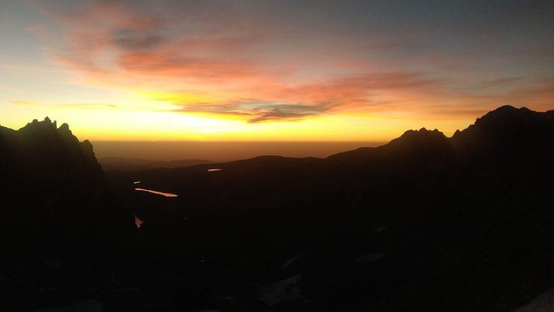 Sunrise over Boulder from a bivy on the Kasparov Traverse.