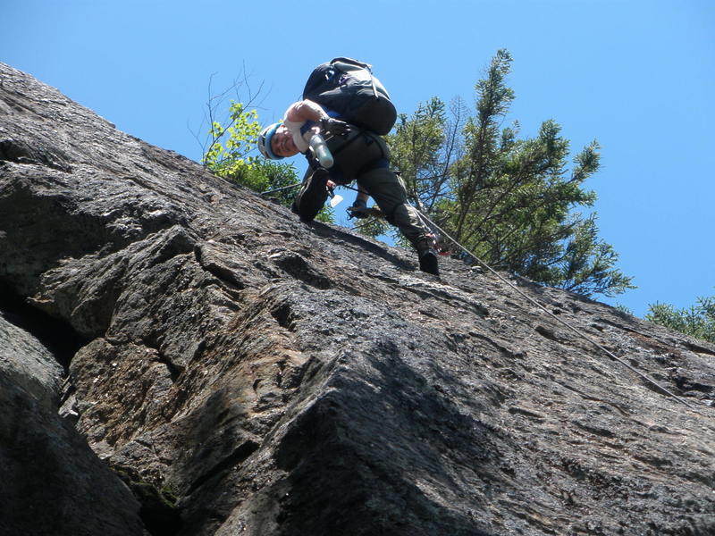 John Rice cleaning upper part of "Windfall" Crack