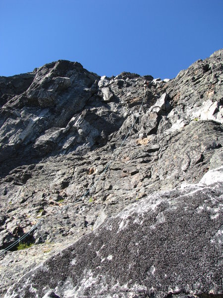First rappel into the gully from the summit. The ascent route follows the large blocky holds to right of the rope.