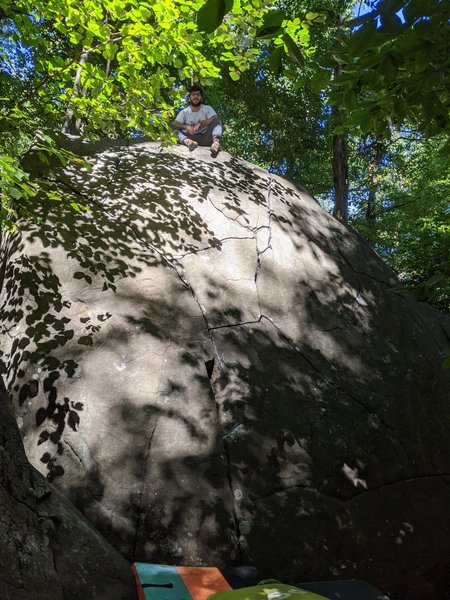 Hard to see the line, but the crack tends vaguely right with lots of jugs, until a crack move or two at the top