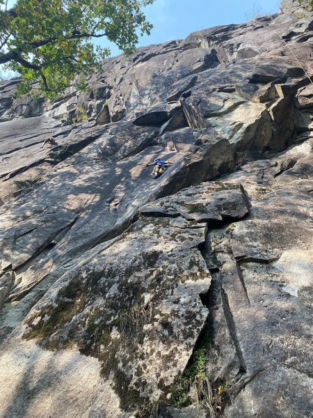 Dr. No (Dahn) balancing on the delicate slab moves of Everything Hertz prior to the crux roof.