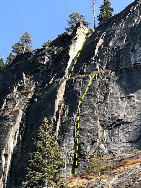 Lovely line up the crack system right of tree, take a left on the ledge through the big dihedral.