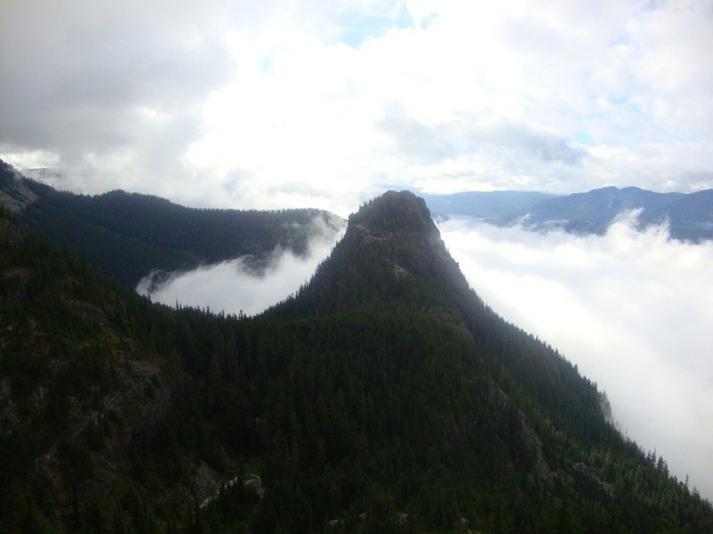 Pass area filled with clouds, Guye towering overhead. From Snoqualmie south shoulder.