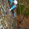 Mary Porter (Shamamama) high up on Infatuation [5.7] on a damp November day. Mind the slippy lichen.