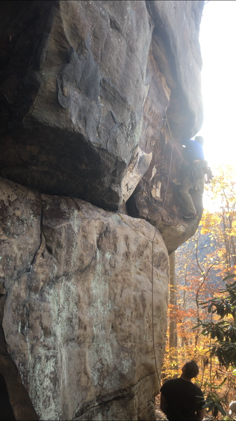 Mitch Lehman on the FA of Arranged Marriage. Start in the diagonal crack seen middle left and then traverse right on the horizontal to pull into the corner. Traverse right and pull corner to establish on Happy Head.