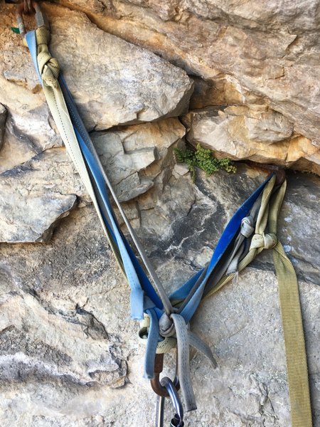 Some rusty old hardware and newer yet sketchy webbing at the top of pitch 1