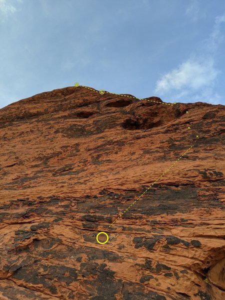 Bewitched first pitch (5.5). A set of hangers can be seen to anchor the belayer if you want.