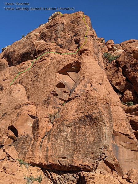 Looking up at the Upper West South Ridge, as seen from the top of Bewitched.<br>
Green: Scramble up and over to the ridge.<br>
Yellow: Climbing up to the top, dashes indicated climbing behind a formation in the photo foreground.