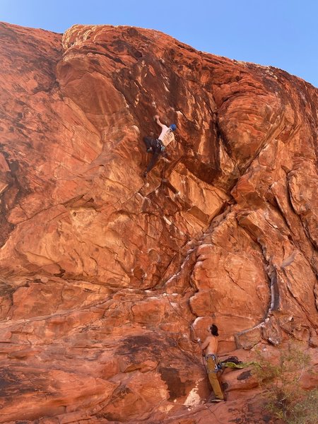 Ethan on his send of Sweet Pain, with Alex on the belay.