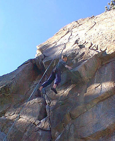 Myke Komarnitsky hanging by the best finger jam of his life.