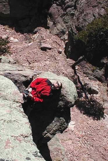 Kurt Komarnitsky catches some rays on the belay ledge for pitch number 2.