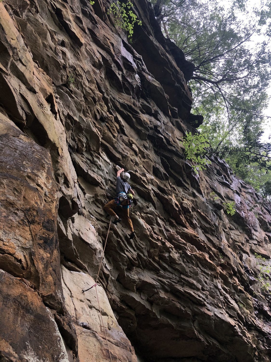 Cruising up the juggy face. Amazing climb on somewhat dirty rock leads ...