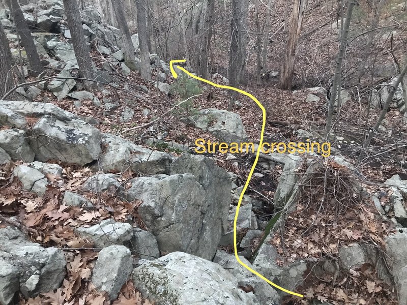 After you cross the stream, walk straight for about 20 feet, and then turn left once you round the next hill.