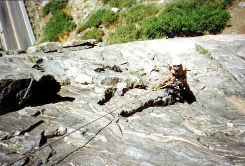 Looking down just above the anchor on the ledge at the top of pitch 1.