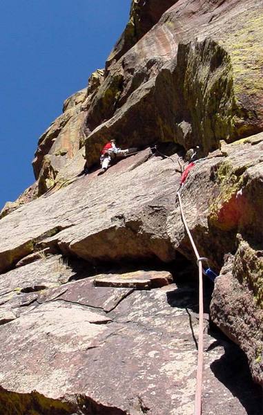 William Prehm moving through the roof traverse on the second pitch of Green Dihedral on the Mickey Mouse Wall.