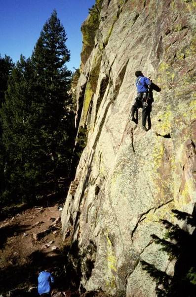 justin dubois on the non descript but fun face climbing below the corner on Xanadu.