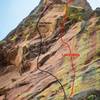 The approximate line of Love Wins is in red; The Perfect Storm is in black. Both routes ascend a first pitch (5.10a) up the gray slab beneath the colorful headwall.