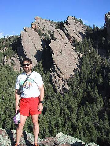 George Bell on the north end of the summit ridge on The Slab, Flatirons South. Above my head are Pellaea and Onoclea. To the right is the Fiddlehead and East Ridge. Photo by Mark Oveson.