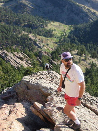George "The Trashman" Bell high above Boulder at the shoulder on Seal Rock