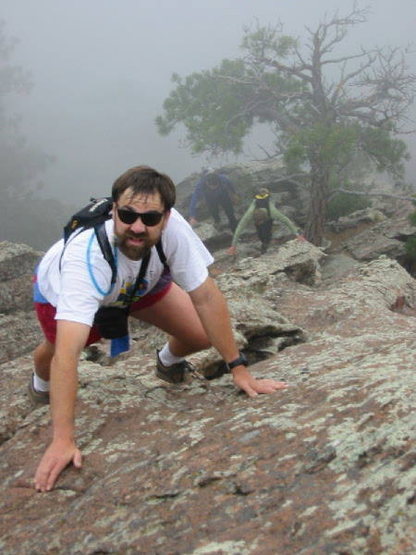 George Bell, Kreighton Bieger, and Warren Teissier just above the crux on a foggy morning.