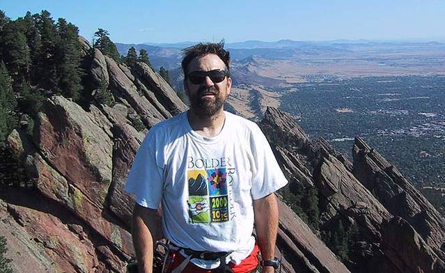 George Bell on the summit of the Fist. Visible behind are the first four Flatirons and the top of Schmoe's Nose.