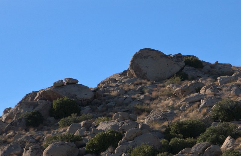 Tall featured slab on the far east side of the Lunar Hill. Clean landing.