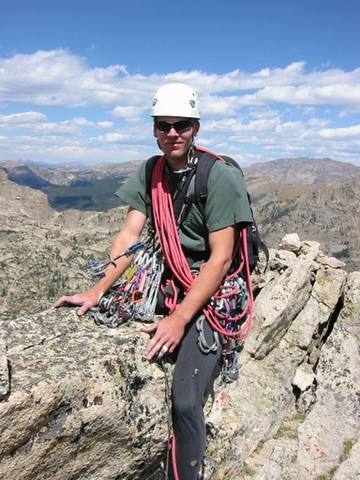 Peter Roth straddling the Lone Eagle Peak summit.  Only 11 miles back to the Trailhead.