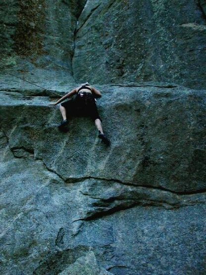 Kate mantling the crux on the first pitch of Athlete's Feat