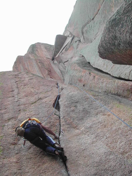 Cleaning the Breashears start after leading it on one rest. Rest of the striking route is shown above - I believe the wide crack shown in the right side of the photo is the 5.10 start for the route.