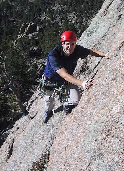 Scott nearing the first belay, with the tree behind him.