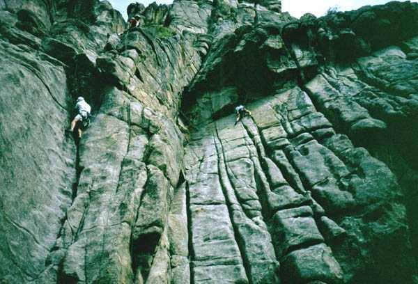 Tony Bubb on Final Exam, jutt below the Pass/Fail Option roof. You can run them together for a long hard pitch. Unknown climber on Curving Crack. Photo by Dianne Connelly.