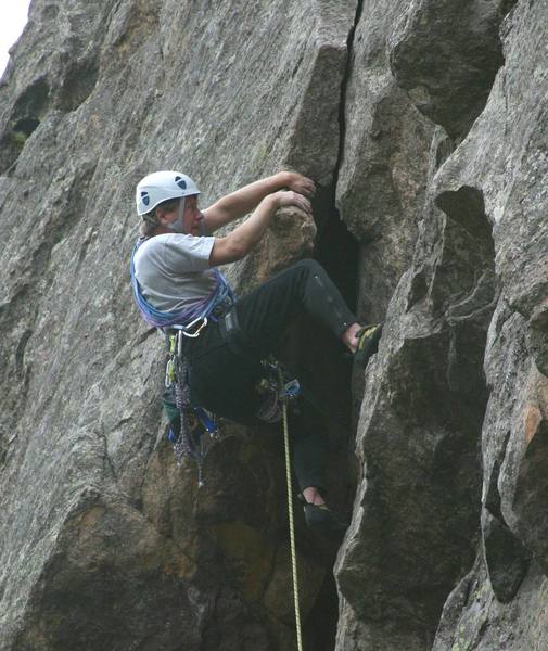 Mark Robbins pulling the crux overhang on the first pitch by Alan Whittern.