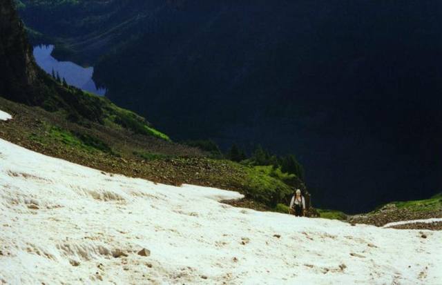 Dave Andrews on the lower snowfield, Crater Lake in the background.