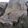 Boulder at base of starting crack of phantom. Boulder can be accessed via a jagged crack system on its left side then starting up wide crack to top. Easy climbing and protectable.