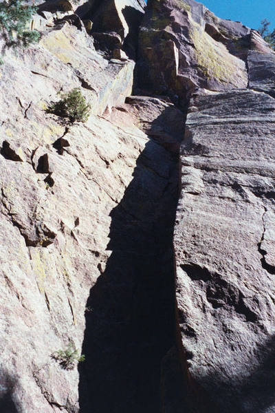 The dihedral on the first pitch in the shade, with the traverse and v-slot visibile above.
