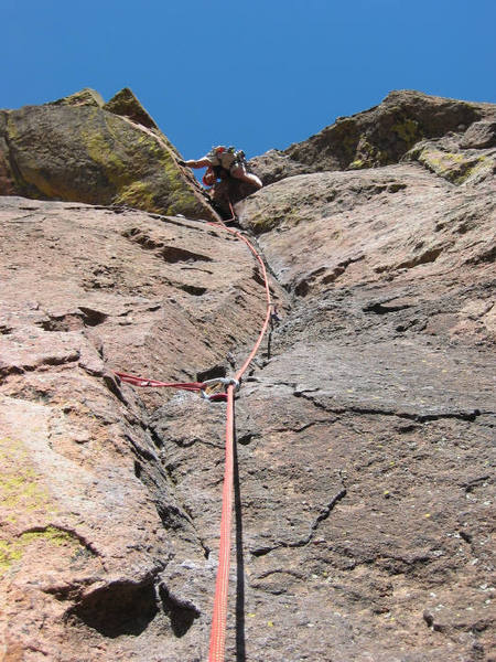 Mike looks down from the crux overhung section of pitch 2.