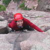 Erin Koenig all smiles as she approaches the top of pitch 1 on Boulder Direct.