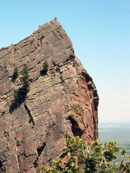 Climbers on the upper two pitches of the Yellow Spur. The climber on the lower right is on the crux bolt ladder. Photo taken from the top of Handcracker on 6/15/03.
