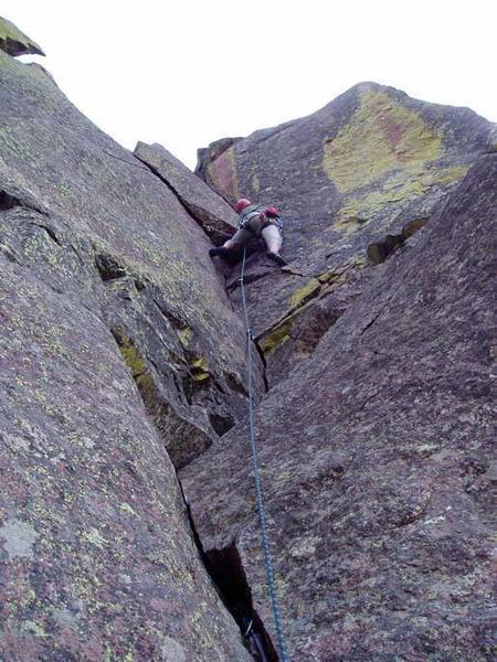 The regular route (see Dihedral), goes left at the flake. The direct goes up the corner to the top.