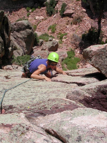 Mary Anne Curtis climbing the crack near the top of the second pitch.