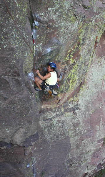 Yvonne D'Andrea cranking the crux on the first pitch. The fun isn't over until she can reach the #1 Camalot above her.