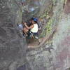 Yvonne D'Andrea cranking the crux on the first pitch.  The fun isn't over until she can reach the #1 Camalot above her.