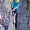 Jean Aschenbrenner climbing the slanting crack on the fourth pitch.