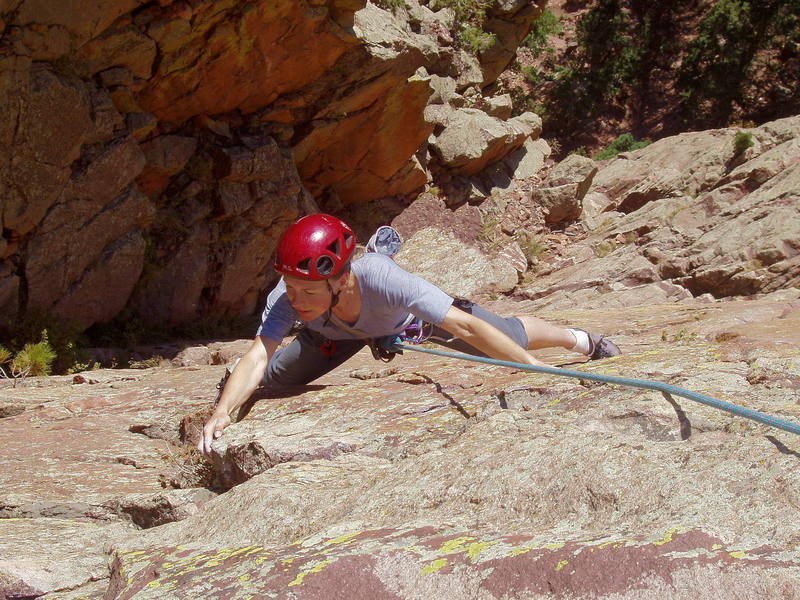 Christa Cline on the crux traverse at the end of the third pitch.