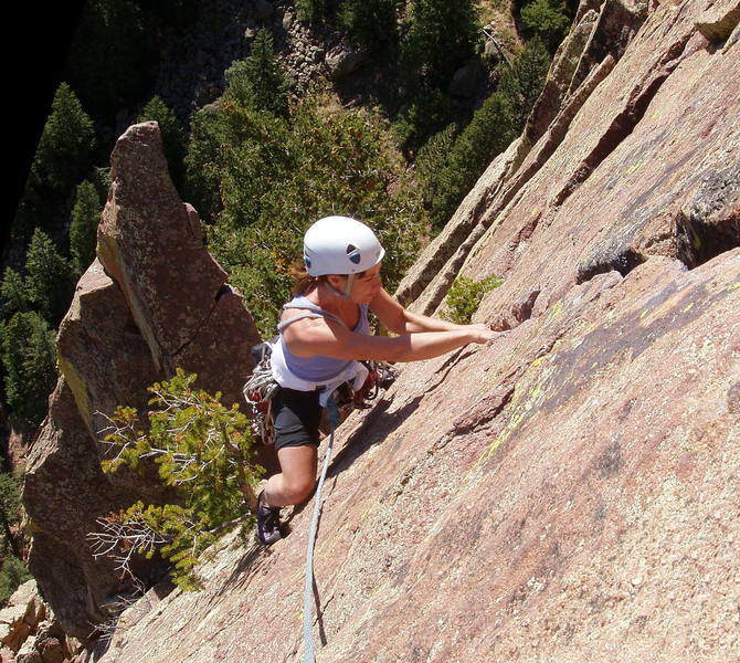 Marga Powell jamming the final crack to the summit. Rebuffat's Arete looms in the background.